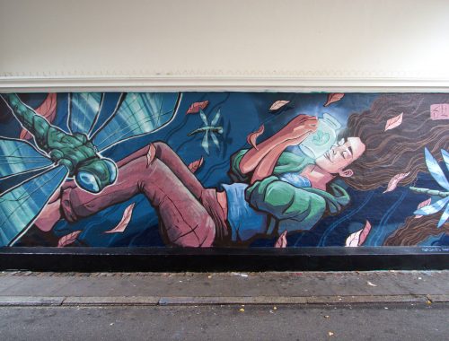 Mural with a Girl a glowy jar dragonflies and leaves Street Art by Chus for Westend Walls in Copenhagen