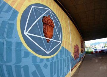 Photo of a detail of the acorn and the platonic geometry from the mural “terra”, by Chus and Ivan Tresoldi