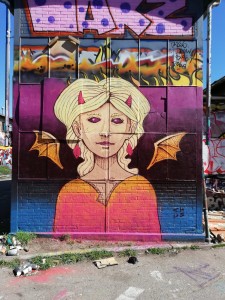 Mural portraying a devil girl Street Art by Chus at Bolsjefabrikken in Copenhagen