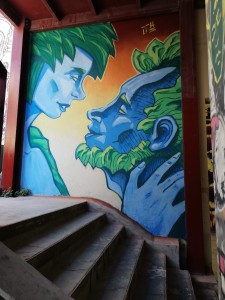 Mural portraying an intimate moment between a couple Street Art by Chus for Athens School of Fine Arts