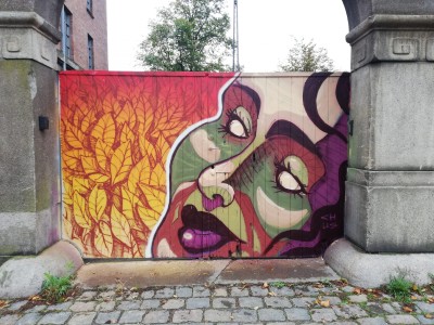 Mural portraying Autumn ad a Woman Street Art by Chus for Valby Kulturhus in Copenhagen
